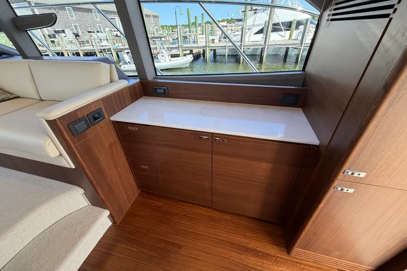 Slide: The Image of Luxurious interior of 2027 Princess F50 yacht with wooden cabinetry and waterfront view. - 78