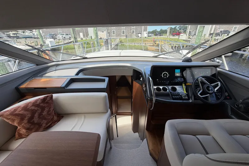 Slide: The Image of Interior of 2027 Princess F50 yacht, featuring modern helm and luxurious seating. - 85