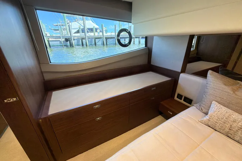 Slide: The Image of Luxurious interior of 2027 Princess F50 yacht with elegant wood cabinetry and waterfront view. - 116
