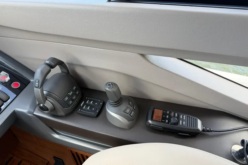 Slide: The Image of Control panel of 2027 Princess F50 yacht with joystick and radio equipment. - 91