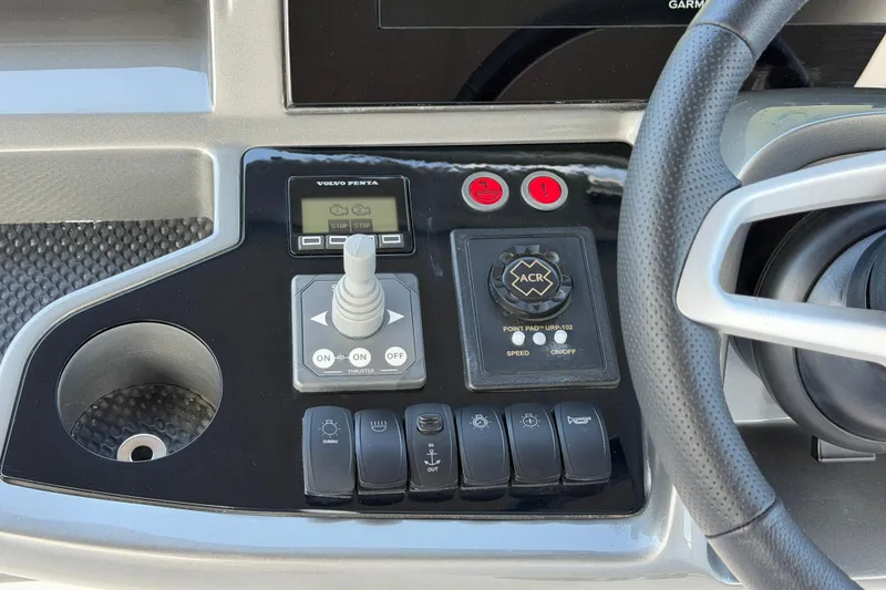 Slide: The Image of Control panel of a 2027 Princess F50 yacht with joystick and steering wheel. - 60