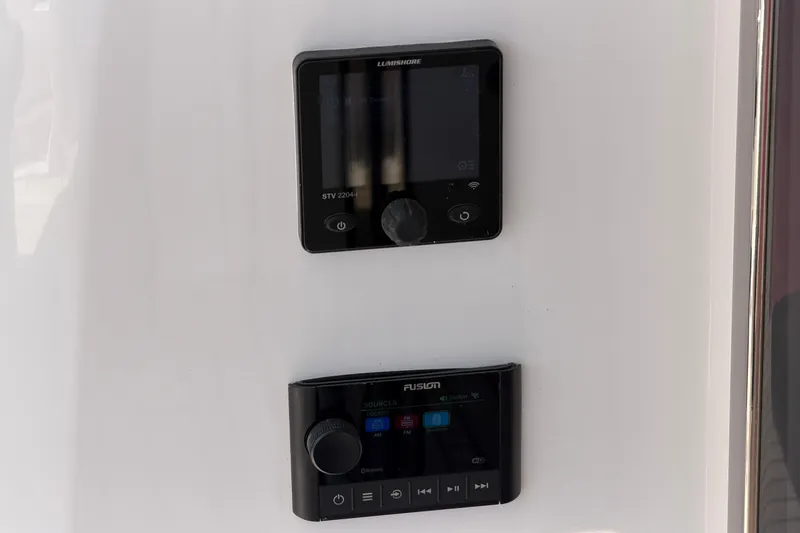 Slide: The Image of Control panels on a 2027 Princess F50 yacht, featuring advanced navigation and audio systems. - 66