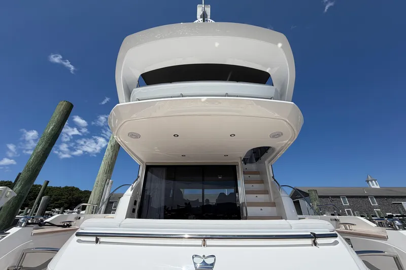 Slide: The Image of Luxury Princess F50 yacht, 2027 model, docked under clear blue sky. - 21