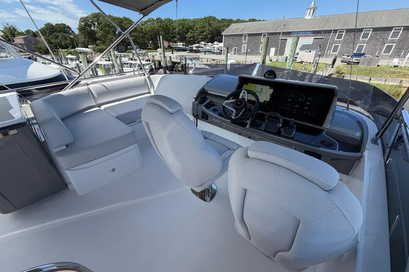 Slide: The Image of Luxurious 2027 Princess F50 yacht cockpit with modern navigation system and plush seating. - 50