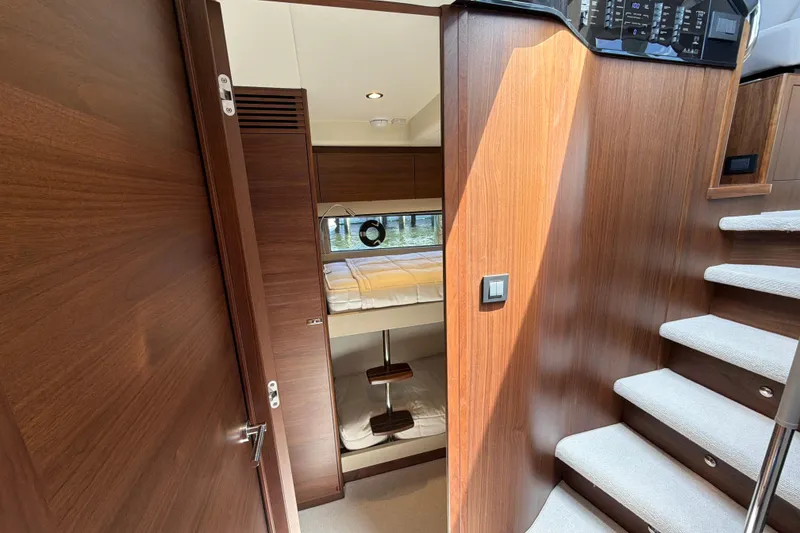 Slide: The Image of Luxurious interior of 2027 Princess F50 yacht with wooden finishes and cozy cabin. - 106