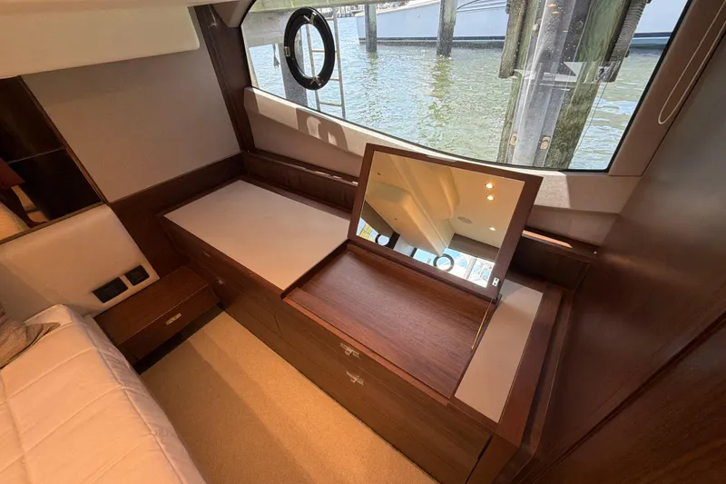 Slide: The Image of Luxurious interior of 2027 Princess F50 yacht with elegant wood finish and vanity mirror. - 120