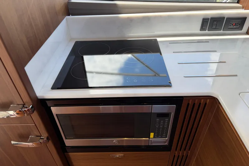 Slide: The Image of Modern kitchen in 2027 Princess F50 yacht with stovetop and microwave. - 74