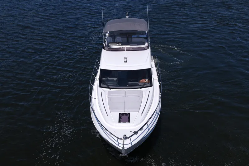 Slide: The Image of 2027 Princess F50 yacht cruising on open water, aerial view. - 17