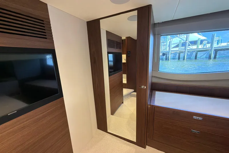 Slide: The Image of Luxurious interior of 2027 Princess F50 yacht with wood finishes and large window view. - 117