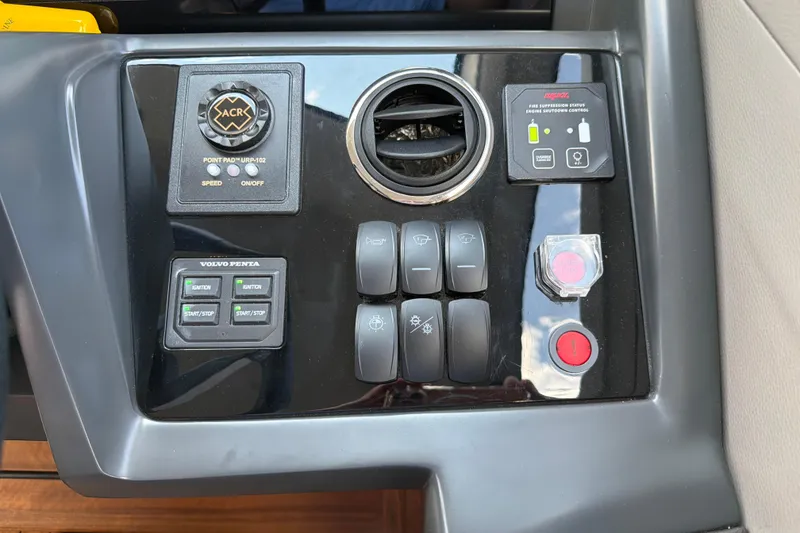 Slide: The Image of Control panel of a 2027 Princess F50 yacht with various switches and buttons. - 92