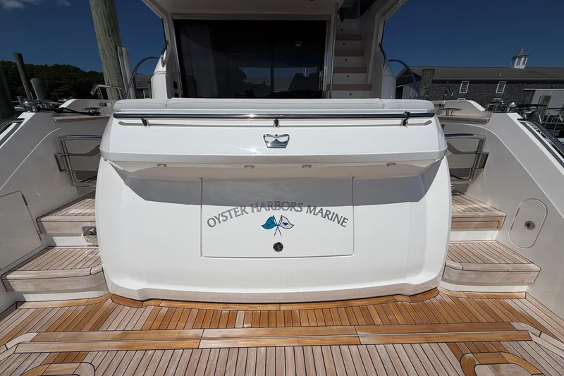 Slide: The Image of Luxury yacht Princess F50 2027 at dock, featuring teak deck and Oyster Harbors Marine branding. - 20