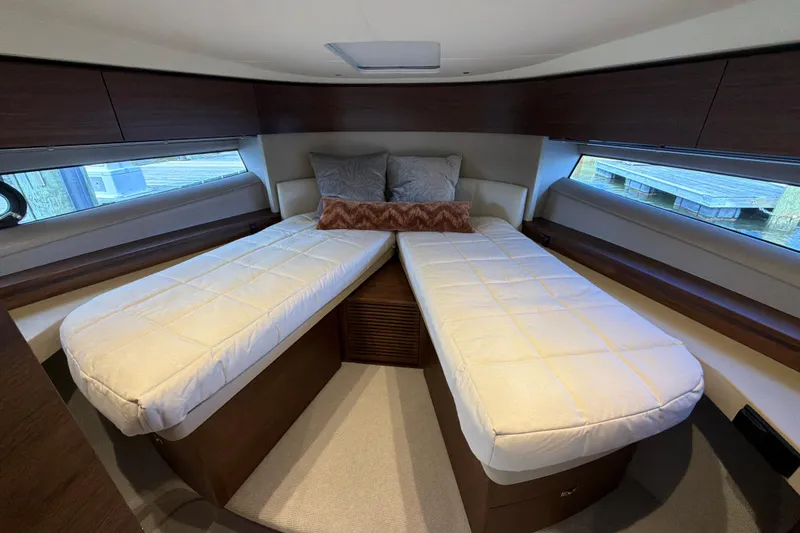 Slide: The Image of Luxurious cabin interior of 2027 Princess F50 yacht with twin beds and elegant decor. - 97