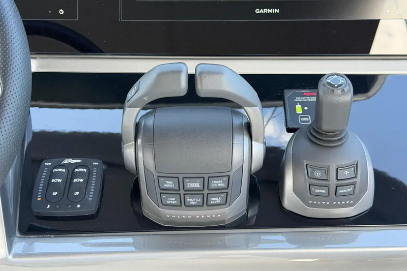 Slide: The Image of Control panel of a 2027 Princess F50 yacht featuring advanced navigation and throttle systems. - 59