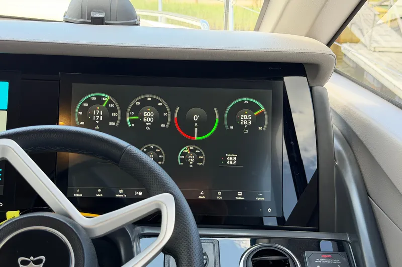 Slide: The Image of Dashboard of a 2027 Princess F50 yacht displaying various engine metrics and controls. - 90