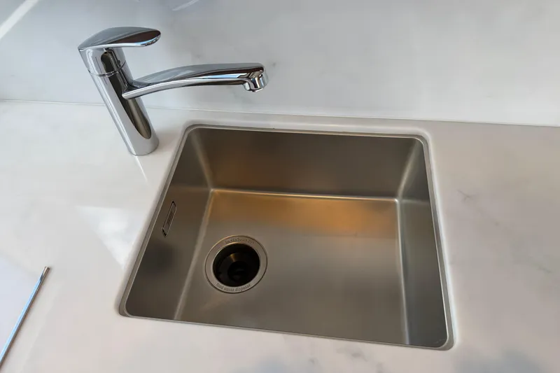 Slide: The Image of Modern stainless steel sink with chrome faucet on a sleek countertop, Princess F50 2027 model. - 75