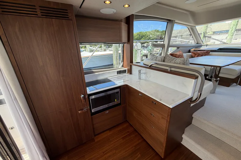 Slide: The Image of Luxurious interior of 2027 Princess F50 yacht with modern kitchen and dining area. - 71
