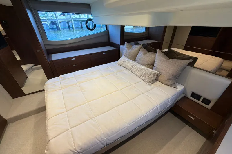 Slide: The Image of Luxurious bedroom interior of 2027 Princess F50 yacht with elegant bedding and large window. - 113