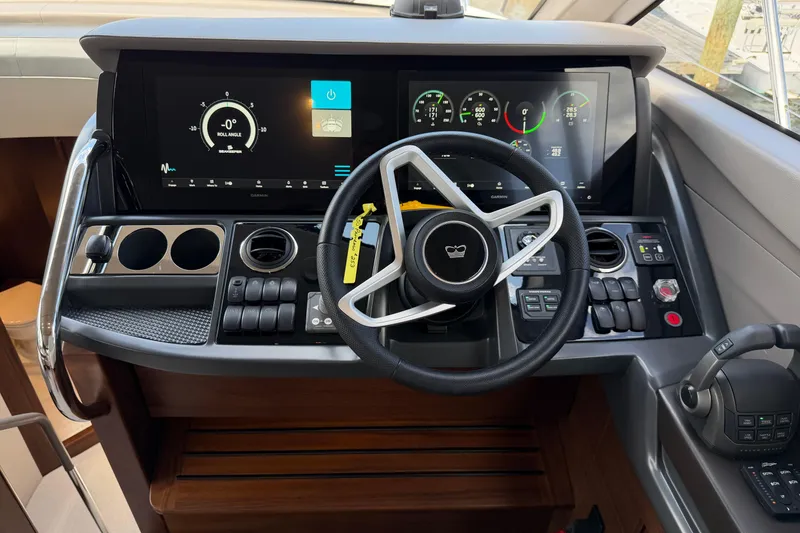 Slide: The Image of Helm of 2027 Princess F50 yacht with modern controls and digital displays. - 88