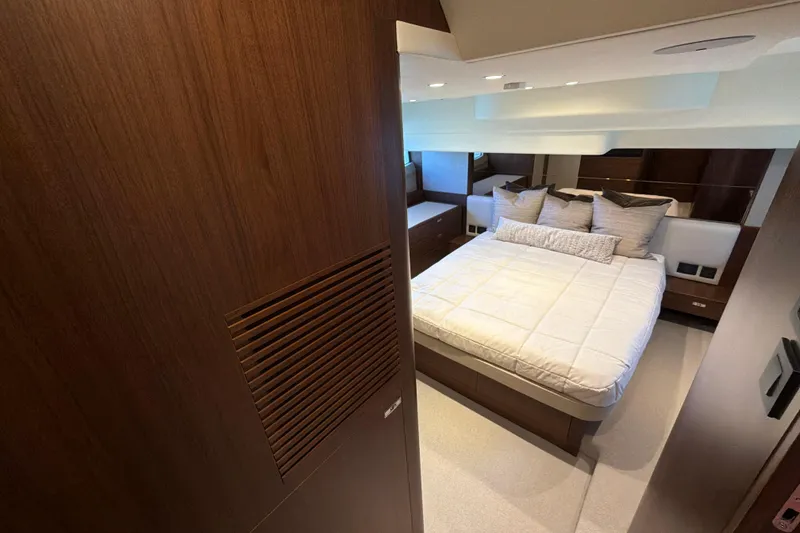 Slide: The Image of Luxurious bedroom interior of 2027 Princess F50 yacht with elegant wood finishes. - 111