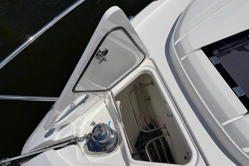 Slide: The Image of Open anchor locker on 2027 Princess F50 yacht, showcasing storage and winch system. - 43