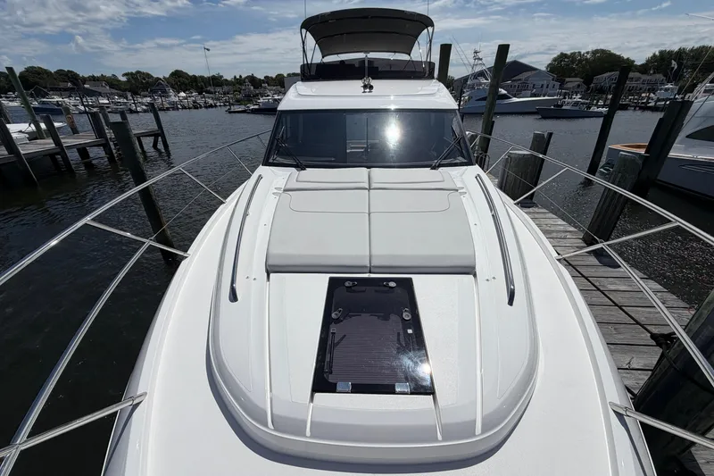 Slide: The Image of 2027 Princess F50 yacht docked at marina, showcasing sleek design and spacious deck. - 41