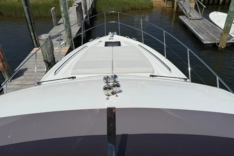 Slide: The Image of Front view of a 2027 Princess F50 yacht docked at a marina. - 63