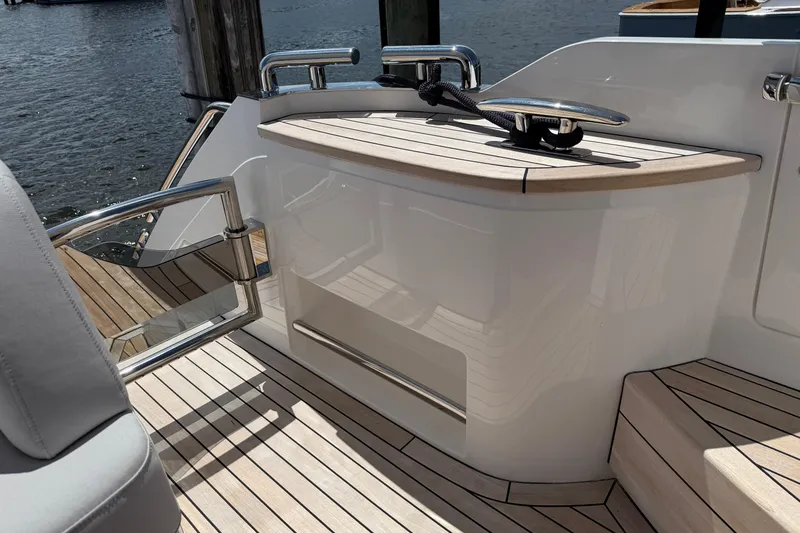 Slide: The Image of Luxury deck area of 2027 Princess F50 yacht with sleek wood finish and chrome details. - 25