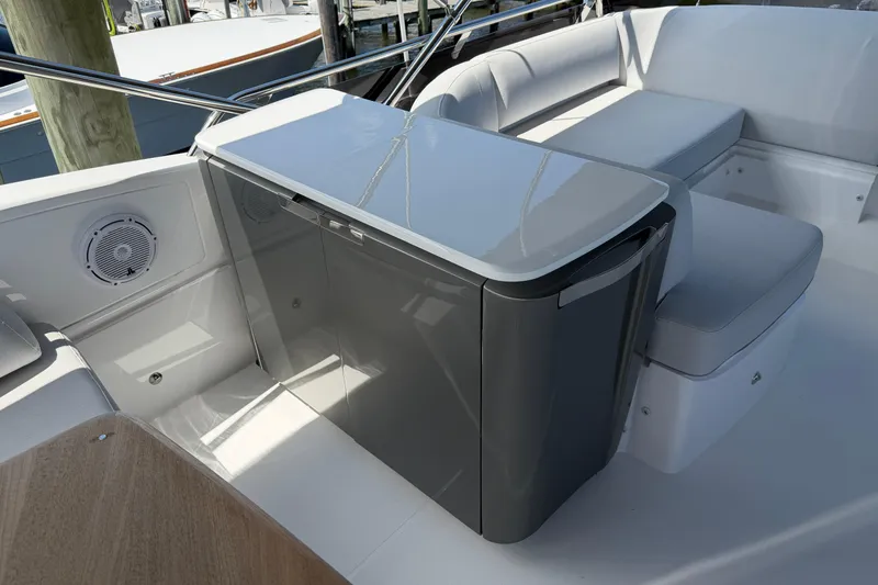 Slide: The Image of Luxurious seating area on a 2027 Princess F50 yacht with sleek design and modern amenities. - 52