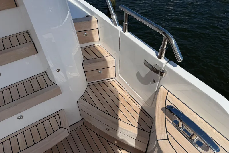Slide: The Image of Luxurious teak deck stairs on a 2027 Princess F50 yacht, featuring sleek stainless steel railings. - 26
