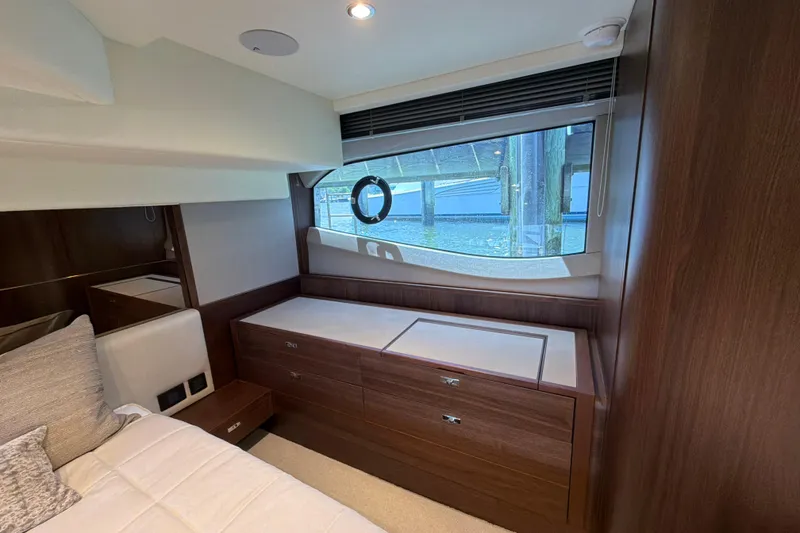 Slide: The Image of Luxurious interior of 2027 Princess F50 yacht with elegant wood finish and large window view. - 119