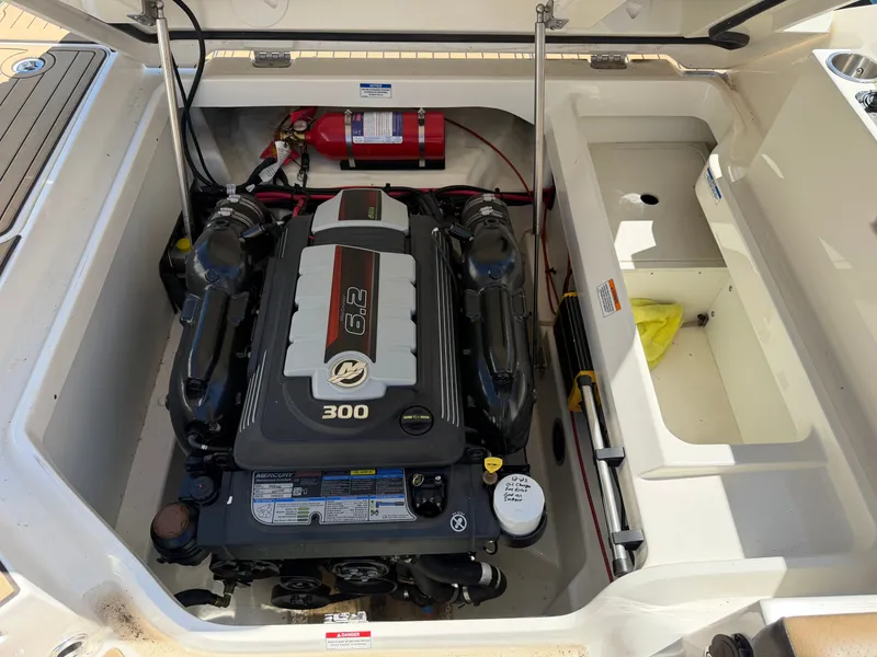 Slide: The Image of Engine compartment of a Sea Ray SDX 250 boat with a 6.2L 300 HP engine. - 21