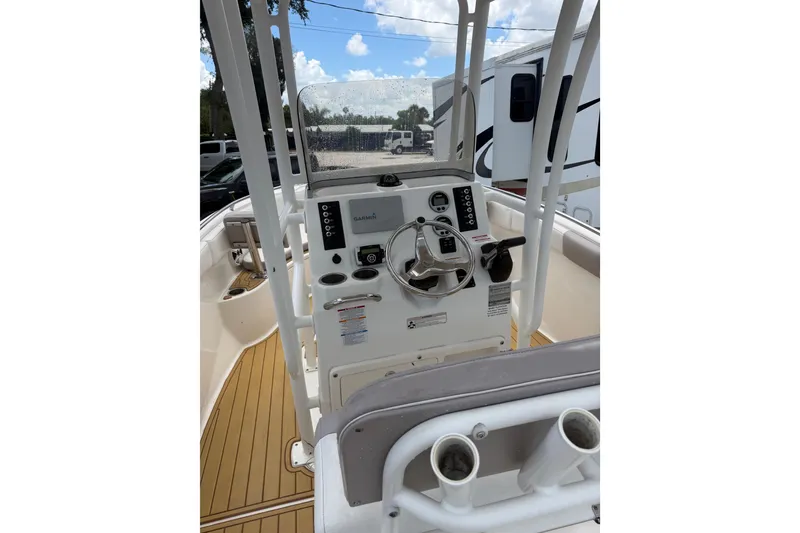 Slide: The Image of 2017 Robalo R222 Center Console boat interior with steering wheel and controls. - 16