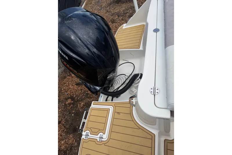 Slide: The Image of 2017 Robalo R222 Center Console boat with Yamaha outboard motor and teak-style deck. - 20