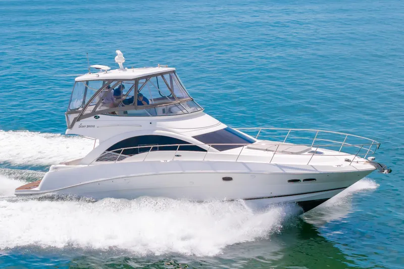 The Image of 2008 Sea Ray 47 Sedan Bridge yacht cruising on open water. - 0