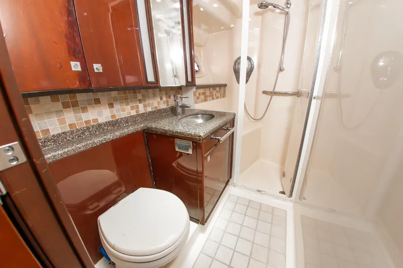 Slide: The Image of Luxurious bathroom in 2008 Sea Ray 47 Sedan Bridge yacht with shower and modern fixtures. - 12