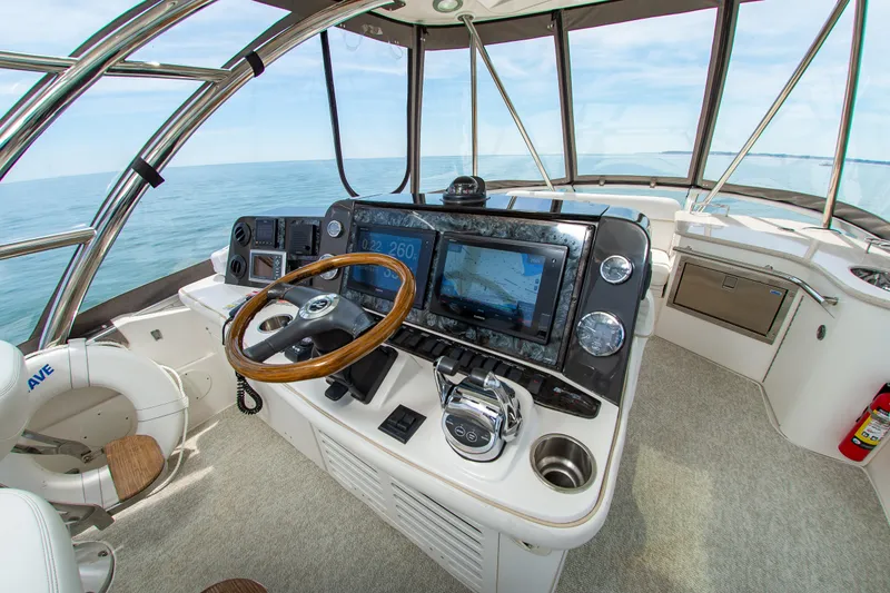 Slide: The Image of Helm of 2008 Sea Ray 47 Sedan Bridge yacht with navigation equipment and ocean view. - 21