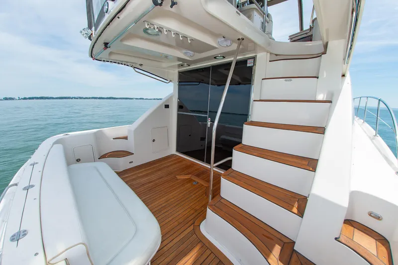 Slide: The Image of 2008 Sea Ray 47 Sedan Bridge yacht with teak deck and elegant staircase. - 27