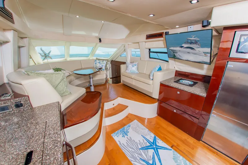 Slide: The Image of Luxurious interior of 2008 Sea Ray 47 Sedan Bridge yacht with elegant seating and modern amenities. - 3
