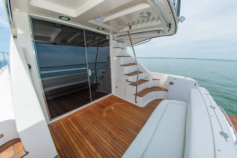 Slide: The Image of 2008 Sea Ray 47 Sedan Bridge yacht with teak deck and elegant staircase. - 32