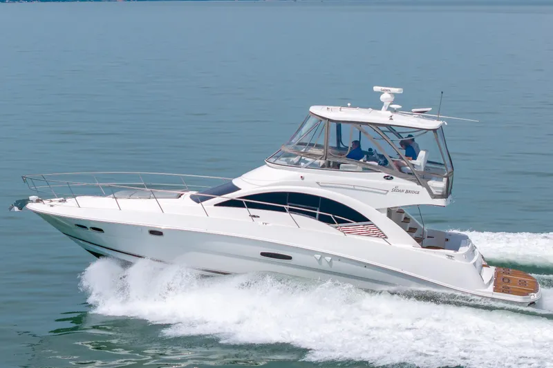 Slide: The Image of 2008 Sea Ray 47 Sedan Bridge yacht cruising on calm waters. - 52