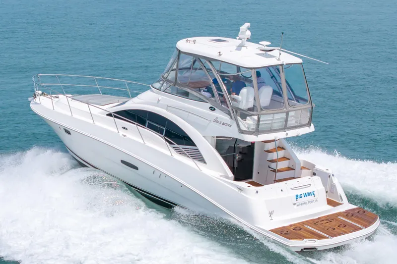 Slide: The Image of 2008 Sea Ray 47 Sedan Bridge yacht cruising on open water. - 53
