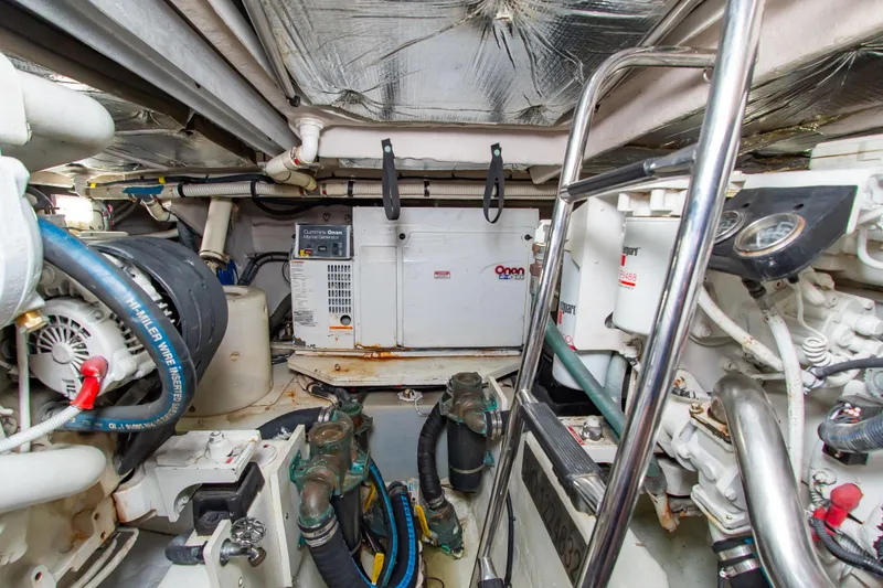 Slide: The Image of Engine room of 2008 Sea Ray 47 Sedan Bridge with Cummins Onan generator. - 57