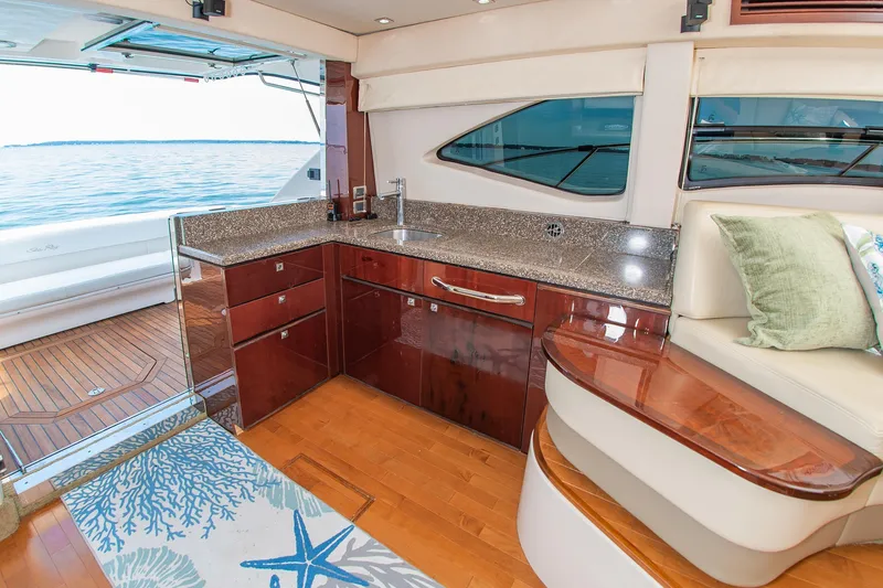 Slide: The Image of Luxurious interior of 2008 Sea Ray 47 Sedan Bridge yacht with elegant kitchen and ocean view. - 8