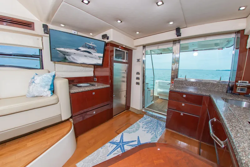 Slide: The Image of Luxurious interior of 2008 Sea Ray 47 Sedan Bridge yacht with modern amenities and ocean view. - 9