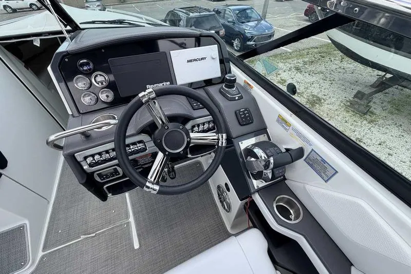 Slide: The Image of Cockpit of 2022 Formula 290 Bowrider with steering wheel and control panel. - 10