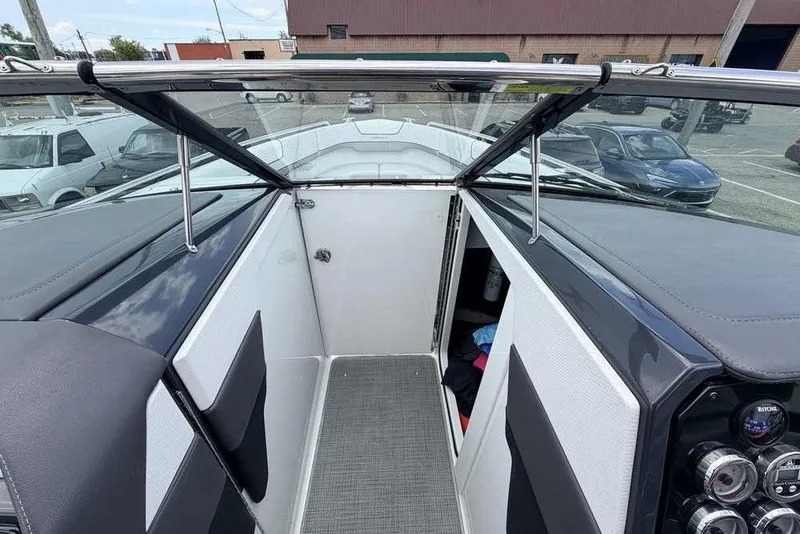 Slide: The Image of 2022 Formula 290 Bowrider interior view with open windshield and dashboard controls. - 12