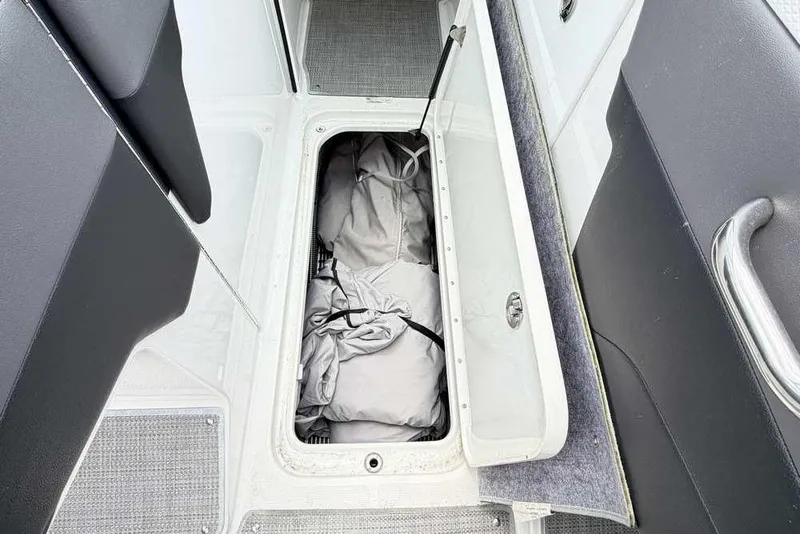 Slide: The Image of Storage compartment in 2022 Formula 290 Bowrider boat, featuring interior storage space. - 14