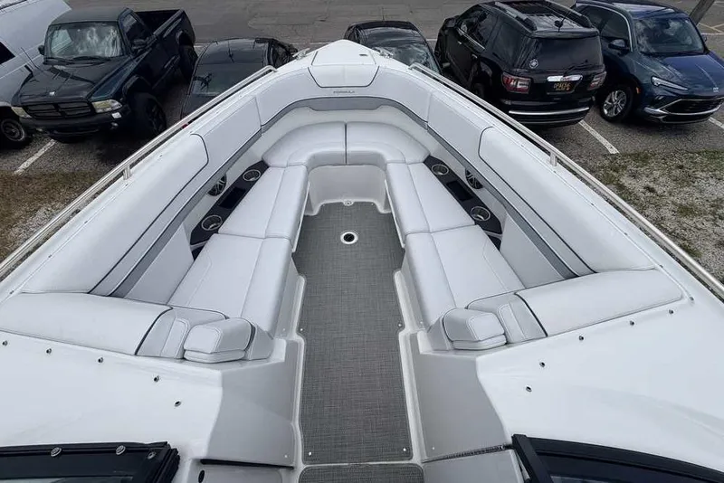 Slide: The Image of 2022 Formula 290 Bowrider boat interior with spacious seating and cup holders. - 17