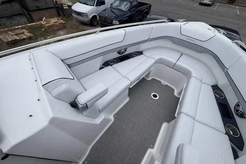 Slide: The Image of Luxurious seating area on a 2022 Formula 290 Bowrider boat, featuring sleek white upholstery. - 19
