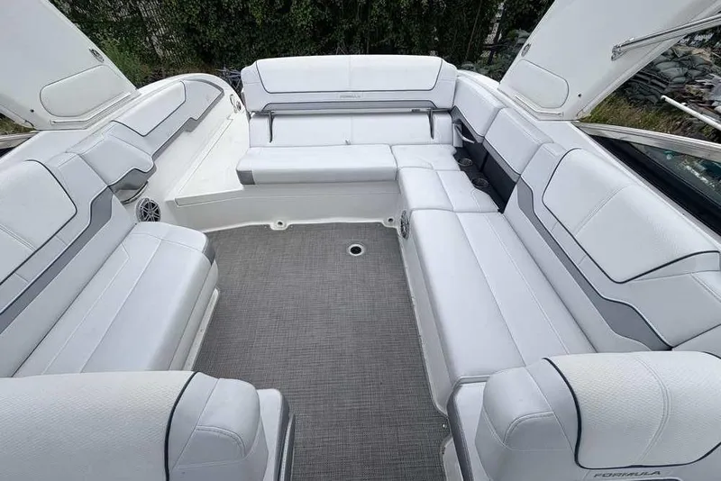 Slide: The Image of Spacious seating area on 2022 Formula 290 Bowrider boat with white upholstery. - 4